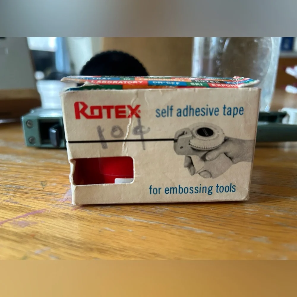 Apsco label maker with two rolls of red tape